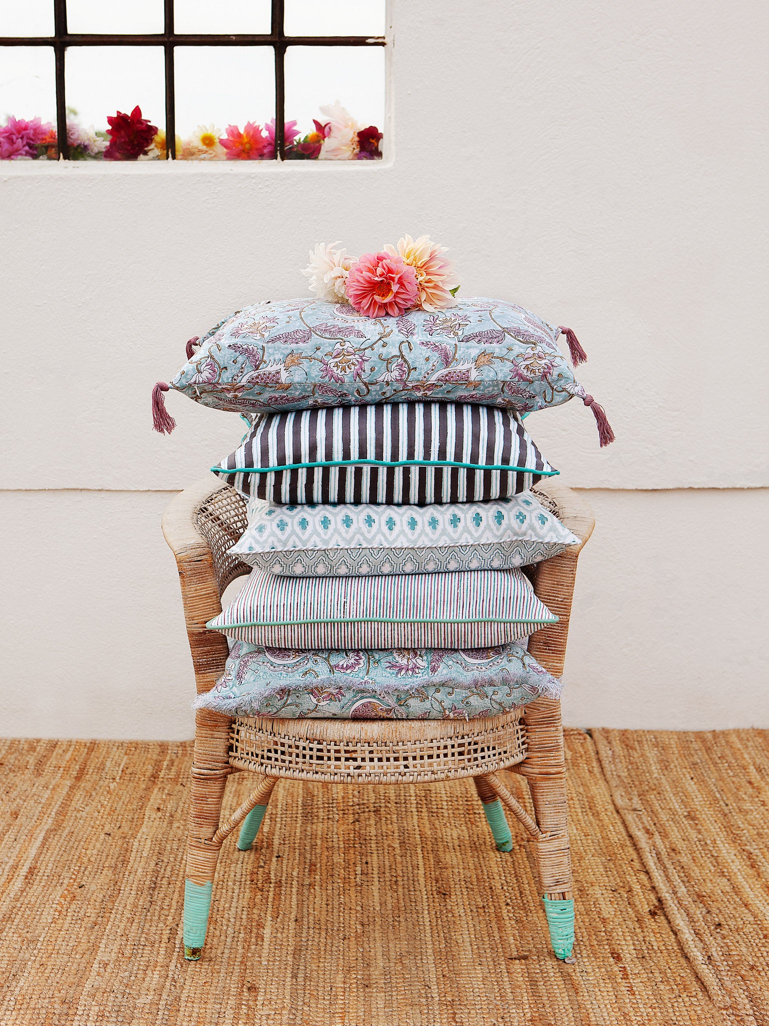 Cushion with turquoise and purple stripes