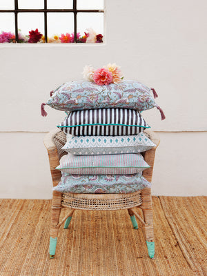 Cushion with turquoise and purple stripes