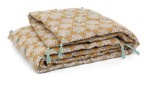 Cotton quilt with City Palace print in Ochre